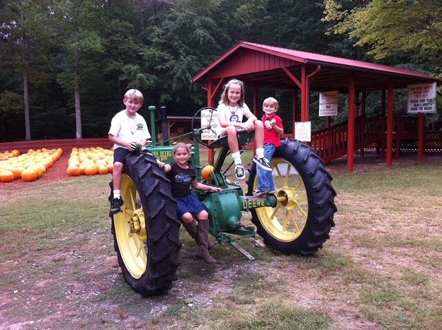 From left, Big Canoe neighbors Jack Lowrie, Olivia Hickman, Miranda Lowrie and Banks Hickman visit Burt’s Pumpkin Farm in 2011.